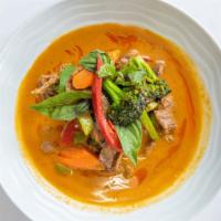 Panang Curry · Spicy. Panang curry paste with coconut milk, bell pepper, peas, carrot and lime leaves.