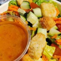 House · Mixed fresh greens, carrots, tomatoes, pickled red onions, choice of dressing.