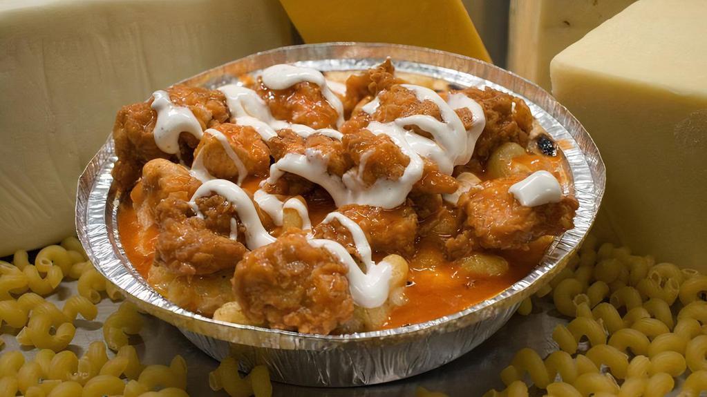 Kidz Angry Buffalo · Our Classic Mac and Cheese topped with Buffalo Fried Chicken, Pepper Jack and Mild Cheddar, and a Ranch Drizzle.