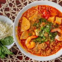 Crab Paste Noodle Soup (Bun Rieu) · Traditional Vietnamese seafood soup w/shrimps, tofu & pork ham (Served w/thin vermicelli noo...
