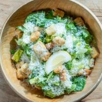 Caesar Salad (Small) · Crisp romaine tossed in our homemade Caesar dressing and topped with croutons and Parmesan c...