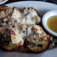 Veggie Grinder · Red sauce with mushrooms, tomatoes, green peppers, mama lil's peppers and provolone cheese, ...