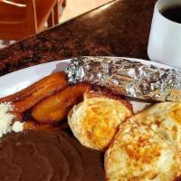 Desayuno Chapin · 3 fried eggs, refried black beans, plantains cheese and sour cream. Choice of corn tortilla ...