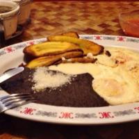 Desayuno Super Chapin · Three fried eggs, refried black beans, grilled steak, plantains cheese and sour cream. Choic...