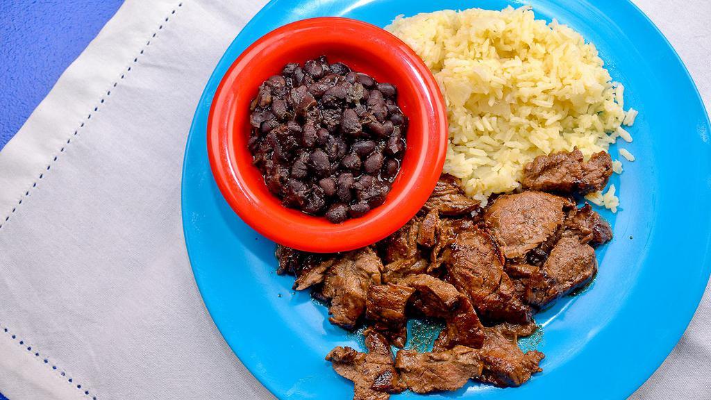 Carne Asado · Tenderized choice steak “churrasco”, that is marinated in our own Puerto Rican inspired citrus marinade, served with black beans and rice.