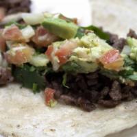 Tacos Carne Asada · Soft corn tortilla with grilled steak, lettuce, tomato and avocado.