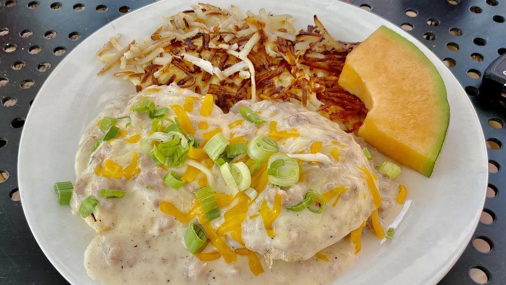 Cowboy Benedict · Two eggs, sausage gravy, toasted muffins, topped with both classic and green chili Hollandaise sauces, green onions, cheese.