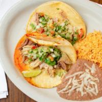 Combo Taco (2 Pc) · 2 tacos with choice of meat served with rice and beans