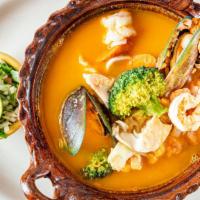 Caldo De Mariscos · Shrimp, fish, scallops, calamari, oysters, clams and vegetables.