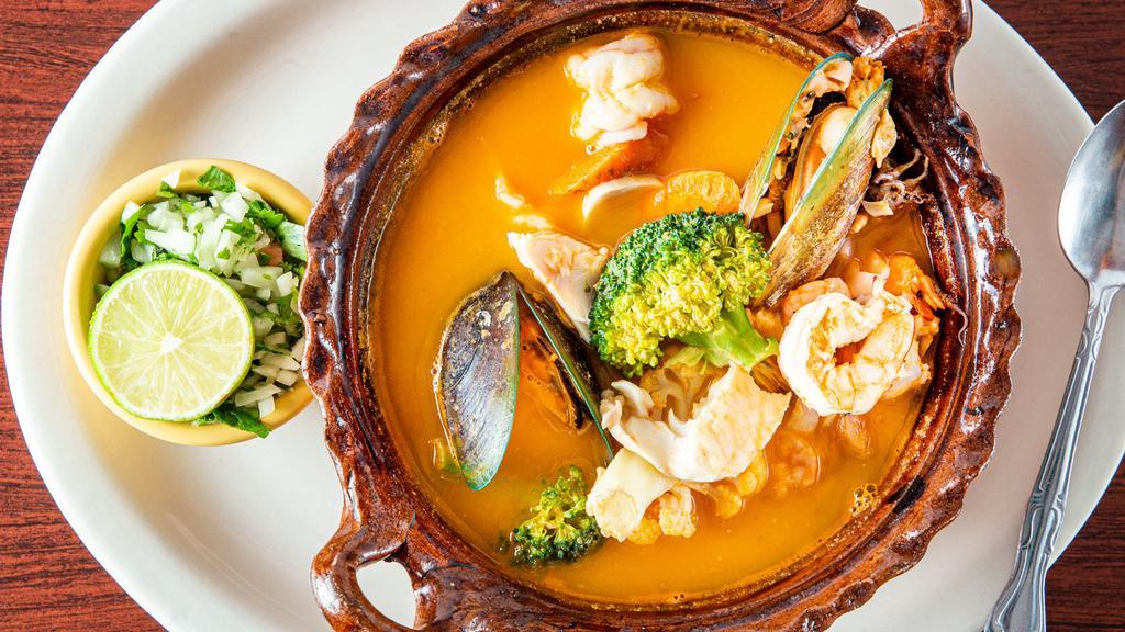 Caldo De Mariscos · Shrimp, fish, scallops, calamari, oysters, clams and vegetables.
