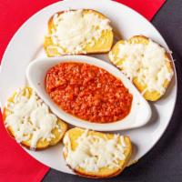 Cheesy Garlic Bread · Our tasty garlic bread with melted mozzarella cheese.
