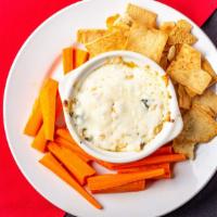 Artichoke Dip · House made spinach artichoke dip with sundried tomatoes and parmesan cheese served with pita...