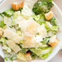 Caesar Side Salad · Green salad with caesar dressing and cheese.
