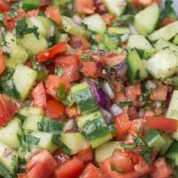 Shirazi Salad · Chopped cucumber, tomato, onions, seasoned with lemon juice dressing.