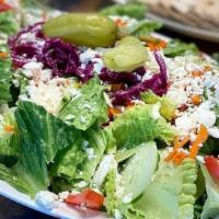 Greek Salad · Lettuce, cucumber, tomato, red cabbage, bell pepper, black olives, and feta cheese tossed in...