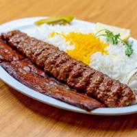 Sultani Kabab · Grilled filet mignon and ground beef kabab served with grilled tomato and basmati rice.