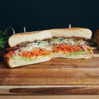 The Guac & Hummus Veggie Sammich · Avocado, carrots, cucumber, alfalfa sprouts, hummus, vegan ranch, and lemon vin, served on c...