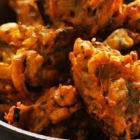 Vegetable Pakora · Mixed Vegetables, spinach, potatoes, cauliflower & onions, deep-fried in chic-pea batter, wi...