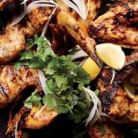 Tandoori Wings · Spicy. Chicken wings are marinated and baked in a clay oven.
(Gluten-Free)