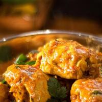 Chicken Curry · Traditional dish of India carefully seasoned with an exotic blend of curry spices, onion, ga...