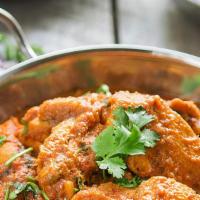 Chicken Tikka Masala · Involves both tandoori cooking and preparation similar to curries, but with a thicker sauce.
