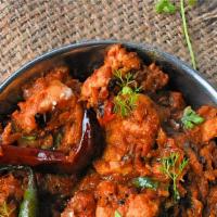 Chicken Tikka Bhuna · Boneless meat pieces cooked with onion, tomatoes, bell peppers, and spices.
