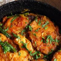 Fish Bhuna · Boneless meat pieces cooked with onion, tomatoes, bell peppers, and spices.