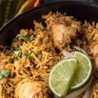 Chicken Biryani · Aromatic basmati rice from India, delicately spiced with spices including saffron.
