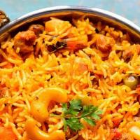 Vegetable Biryani · Aromatic basmati rice from India, delicately spiced with spices including saffron.