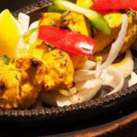 Chicken Tikka · Served with rice, and chutney.