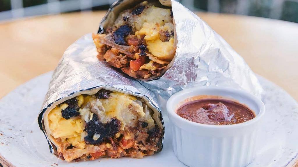 The Arts District · Our egg & cheese breakfast burrito. Wrappin 2 eggs scrambled, melty cheddar cheese, avocado (because LA), crispy tater tots and caramelized onions in a fresh flour tortilla.