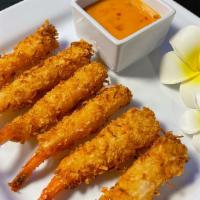 Coco Prawns (6Pc) · Prawns seasoned with shaved coconut, deep fried till crispy, served with yummy sauce.