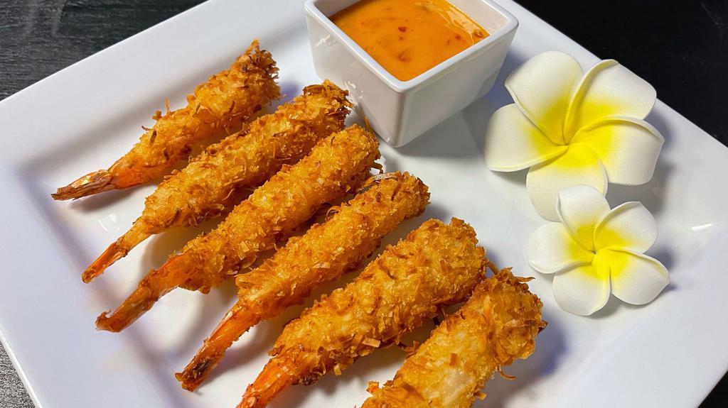 Coco Prawns (6Pc) · Prawns seasoned with shaved coconut, deep fried till crispy, served with yummy sauce.