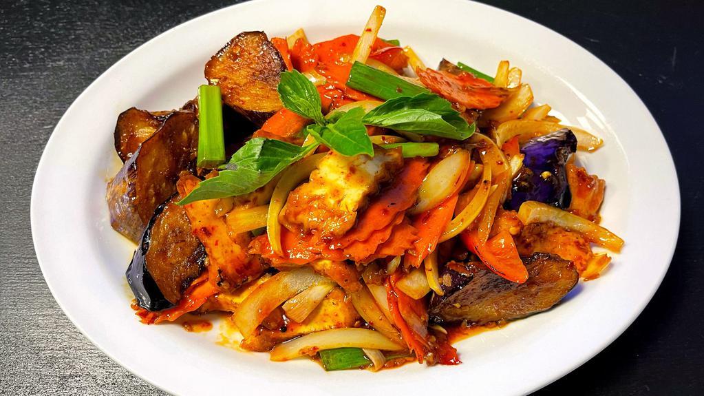 Spicy Eggplant · Stir-fried with eggplant with bell peppers, onions, carrots, and basil leaves.