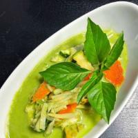 Green Curry · Bamboo shoots, zucchini, carrots, and basil leaves in green curry sauce.