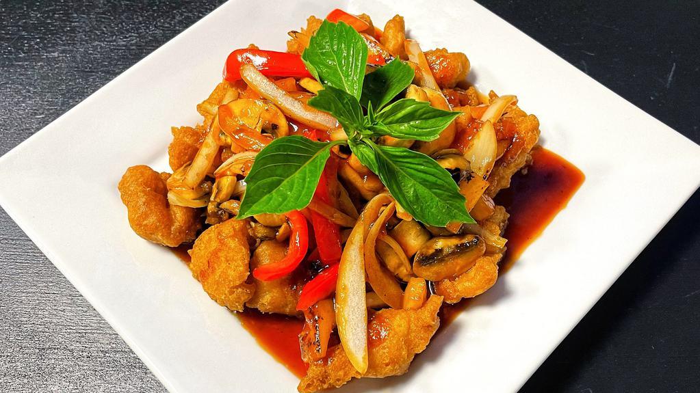 Spicy Crispy Fish · Deep-fried crispy fish in special sweet and sour sauce with pineapple, onions, mushrooms, bell peppers, and basil leaves. (basa fish).