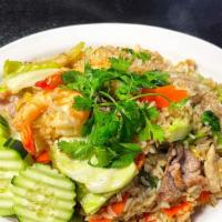 Fried Rice Deluxe · Stir-fried rice with combination of two prawns, eggs, chicken, pork, beef, fried with brocco...