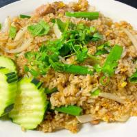 Garlic Fried Rice · Fried rice with eggs, yellow and green onion, top with cilantro and cucumber served on side.