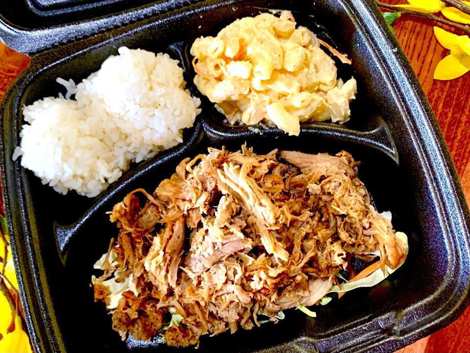 Kalua Pulled Pork Plate · Eight-hour slow roasted pork roast, pulled and seasoned, served with two scoops of rice and Hawaiian mac salad.