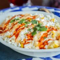Coctel De Elote · Grilled corn cut from the cob, topped with butter, mayo, aged cotija cheese, fresh cilantro,...
