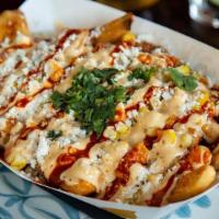 Elote Papas · Homemade seasoned fries topped with grilled corn cut from the cob, butter, mayo, aged cotija...