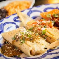 Tamale Trio · Combinations of our Traditional tamales. Pork chile verde topped with roasted tomatillo sals...