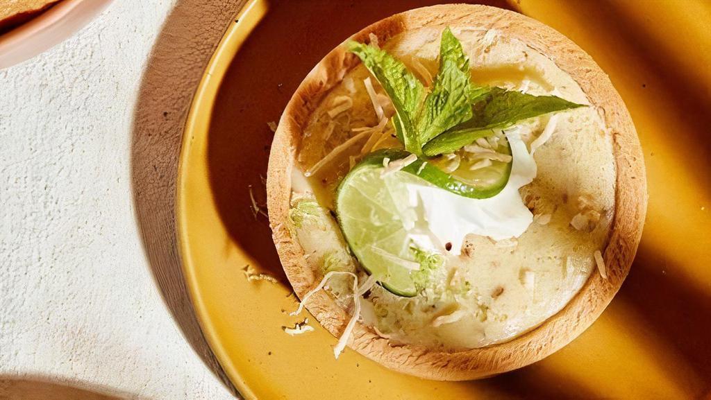 Coconut Key Lime Tart  · Creamy House-made coconut key lime tart topped with whipped cream and toasted coconut.