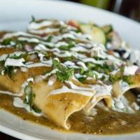 Azteca Enchiladas · Delicately slow-cooked beef short rib and melted Oaxaca cheese. . Topped with our homemade g...