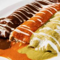 Trio Enchiladas De Mole · Combination of 3 Enchiladas topped with homemade mole sauces. Chicken with black mole sauce,...