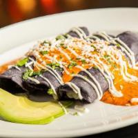 Mariscos Enchiladas · Hand pressed blue corn tortillas filled with Oaxaca cheese, fresh lump crab meat, shrimp and...