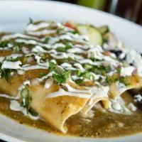 Poblanos Enchiladas · Tender pulled chicken with Oaxaca cheese, spinach and mushrooms.. Topped with a creamy roast...