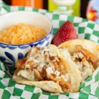 Chicken Tacos Kids · 2 chicken tacos.. Side choice of either Barrio fries, black beans, mixed fruit, rice or vegg...