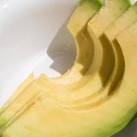 Avocado Side · Slices of freshly cut avocado.