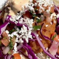 Fried Camaron Taco · Negra Modelo beer-battered shrimp. Topped with red cabbage, homemade pico de gallo, queso fr...